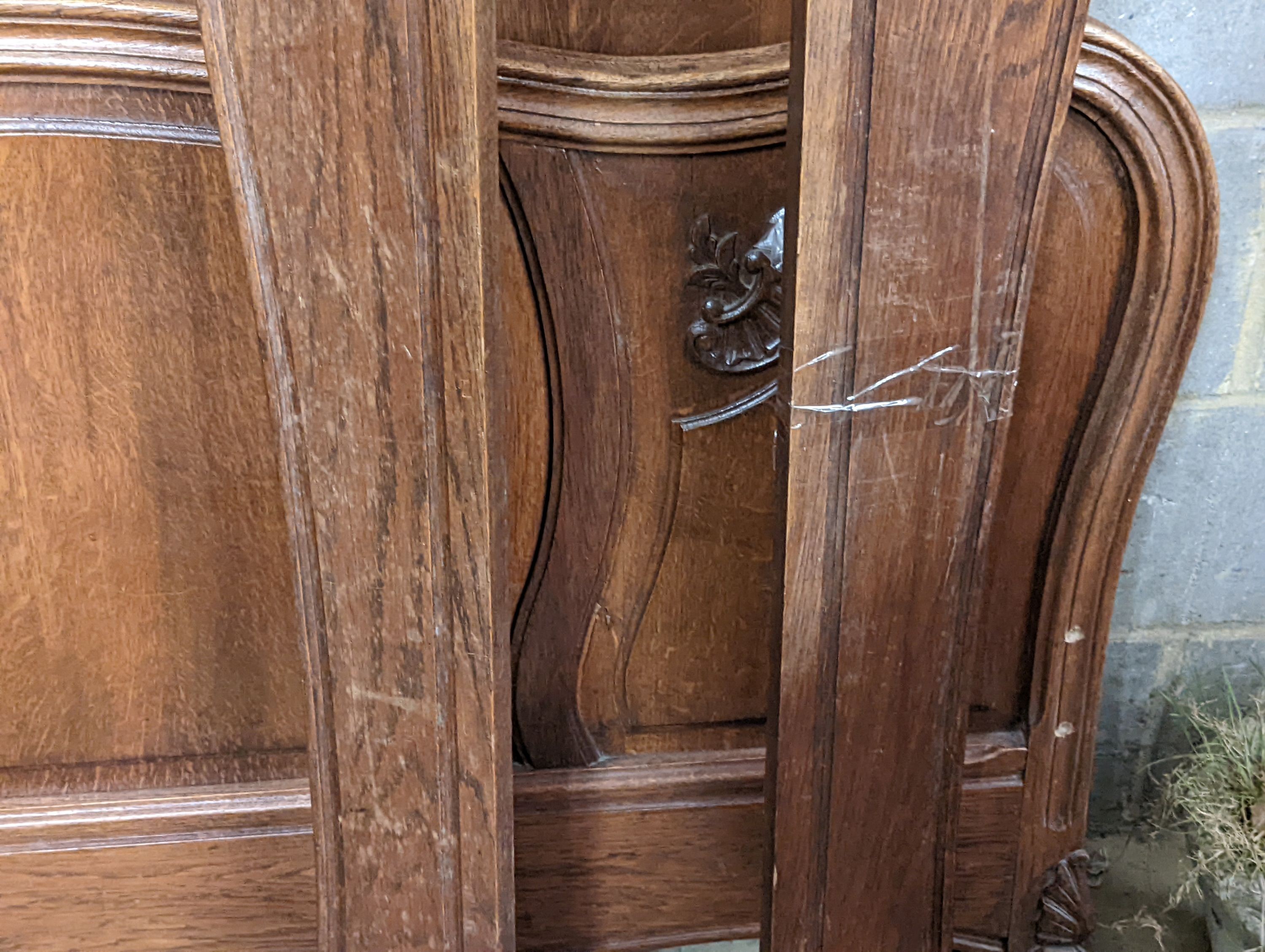 A late 19th century French oak bed frame, no bolts, width 140cm